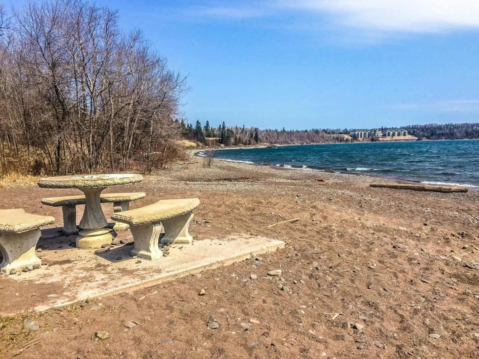 Burlington bay beach and stone chairs and table.