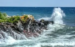 Waves crashing on rocky shores.