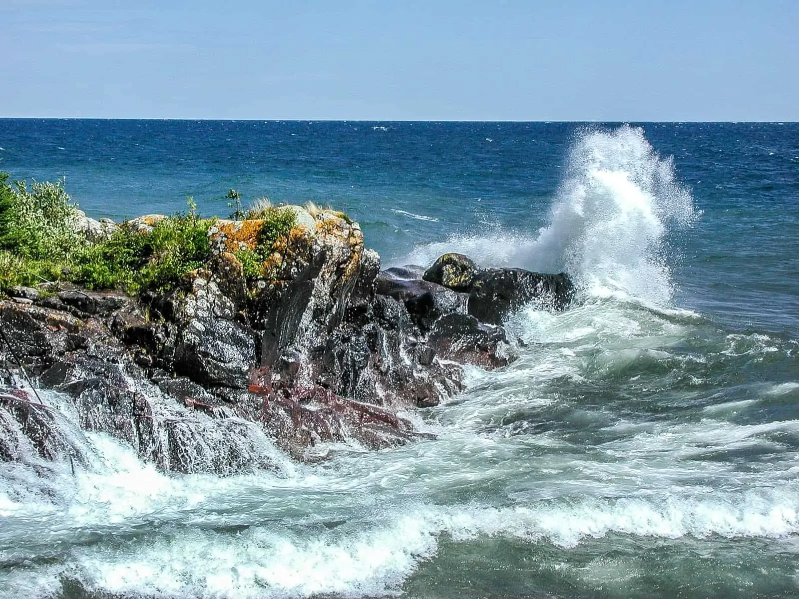 Waves crashing on rocky shores.