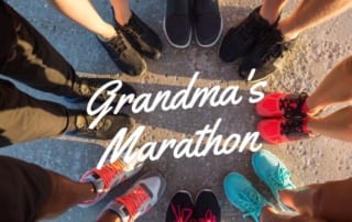 Several people's shoes. Text: Every June, Grandmas Marathon, Duluth, MN.
